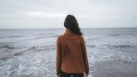 A person quietly dealing with anxiety after drinking alcohol