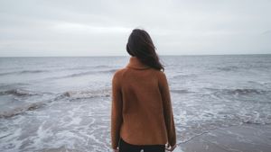A person quietly dealing with anxiety after drinking alcohol