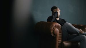 A person quietly dealing with the struggle caused by drinking alcohol